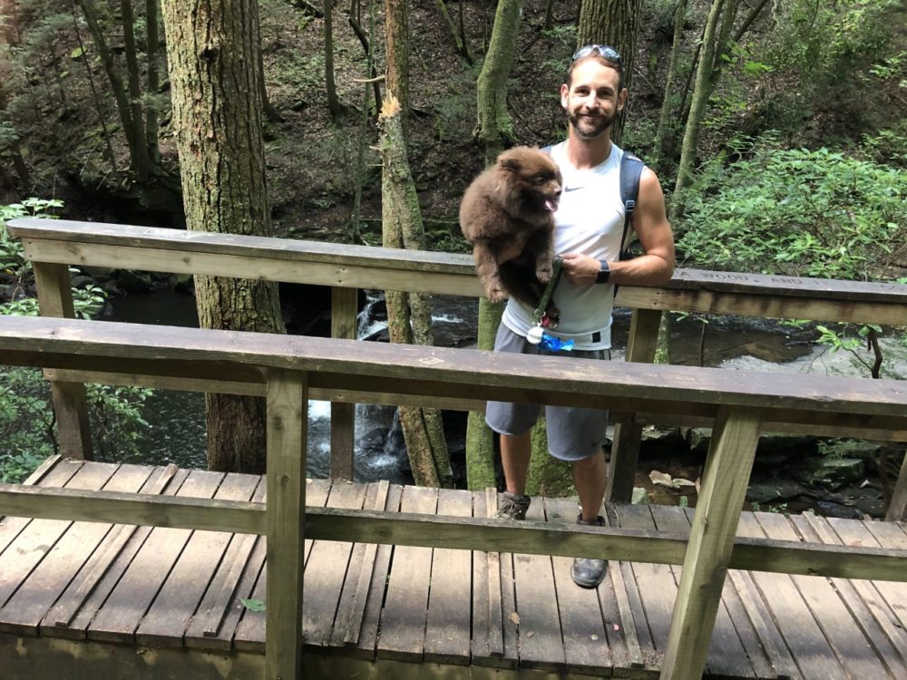 Portrait: travis with dog on hike